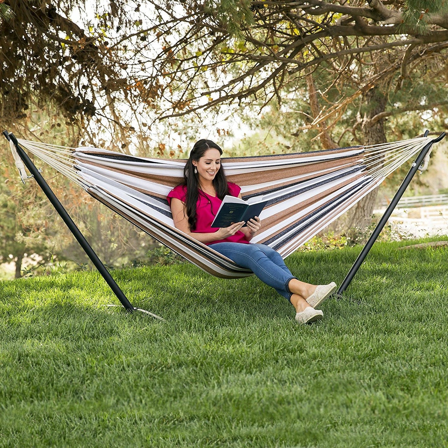 Woman relaxing in Portable Cotton Hammock in Desert Strip with Metal Stand and Carry Case outdoors
