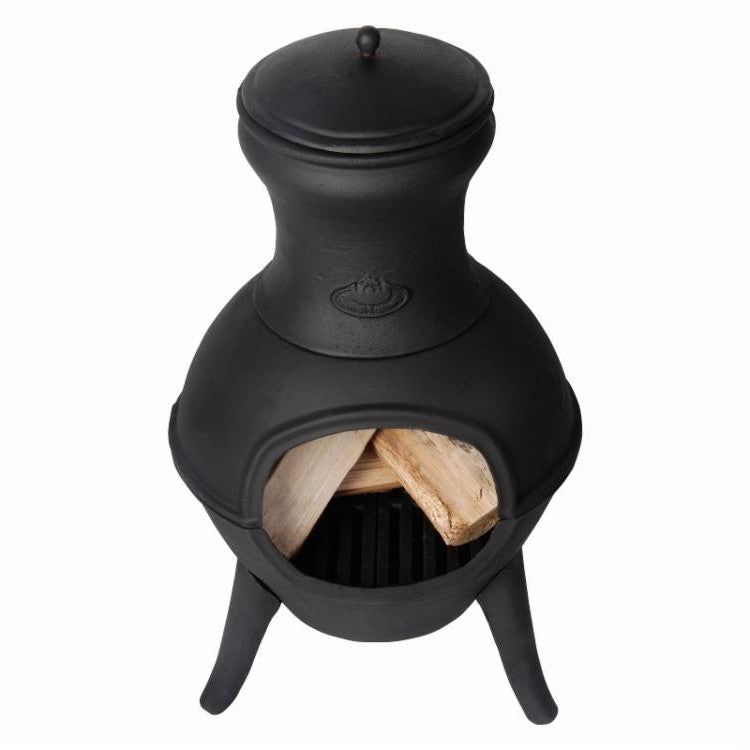 Small Black Outdoor Cast Iron Chimenea Wood Burning Fire Pit with a load of wood inside, ideal for patio heating.