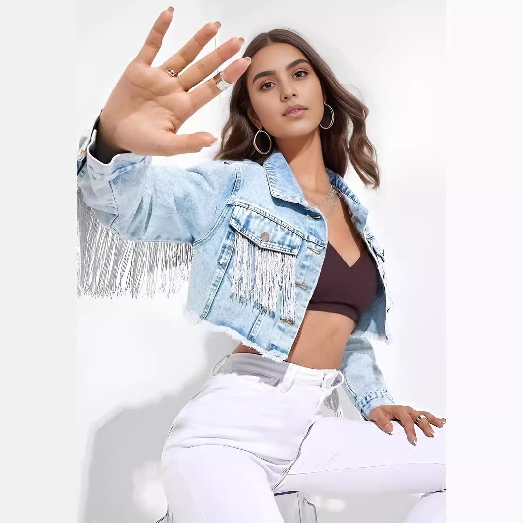 Model wearing Fringe Rider Short Denim Jacket with fringe detailing, paired with white jeans and stylish accessories.