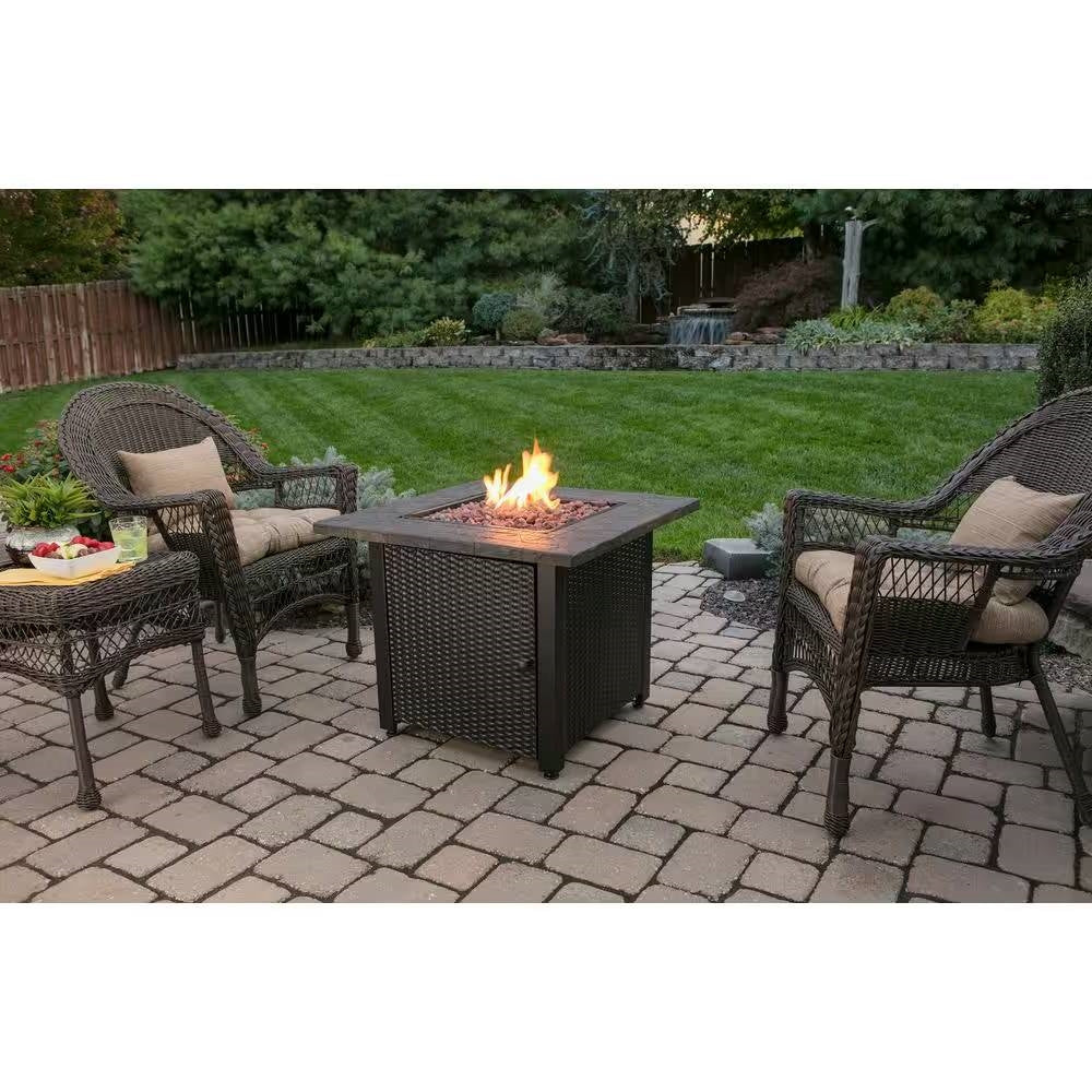 30-inch Outdoor Bronze LP Propane Gas Fire Pit with Lava Rocks and Cover in garden setting
