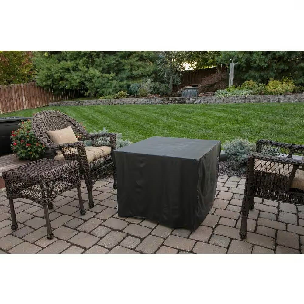 30-inch Outdoor Bronze LP Propane Gas Fire Pit with Lava Rocks and Cover in a garden setting.