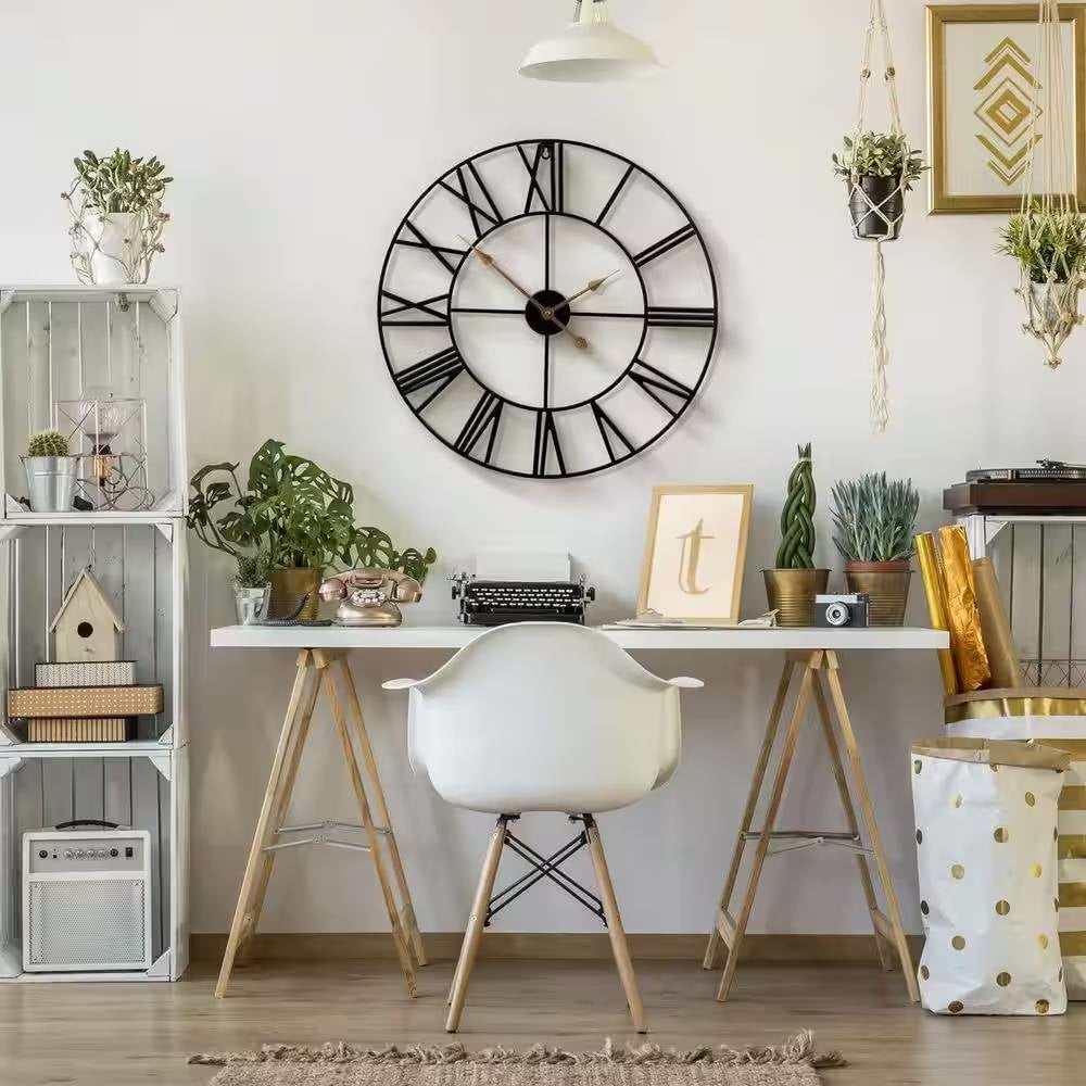 Round 24-inch Black Metal Roman Numeral Wall Clock with Gold Hands displayed in a stylish modern living room setup.