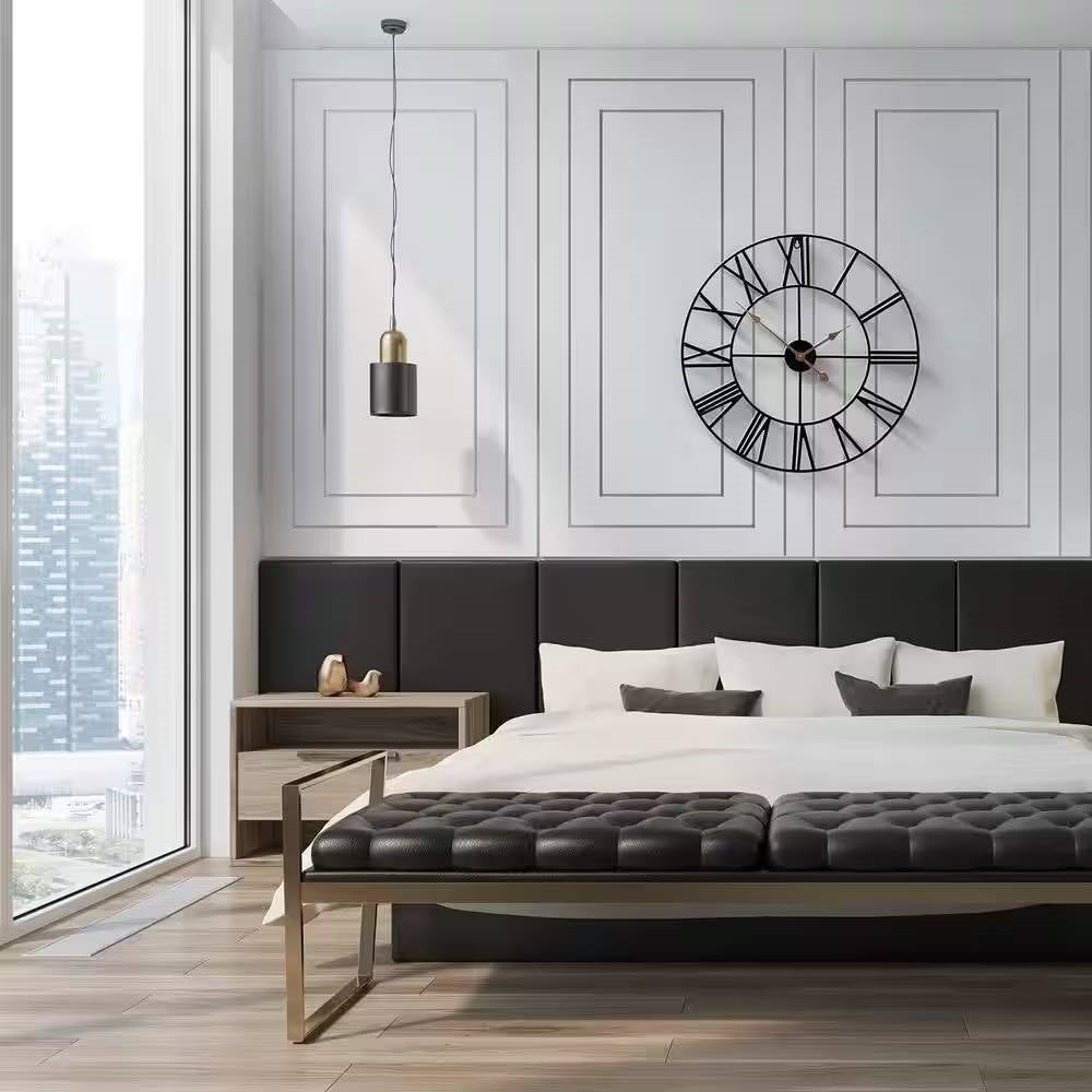 Elegant bedroom with Round 24-inch Black Metal Roman Numeral Wall Clock with Gold Hands above the bed, modern decor.