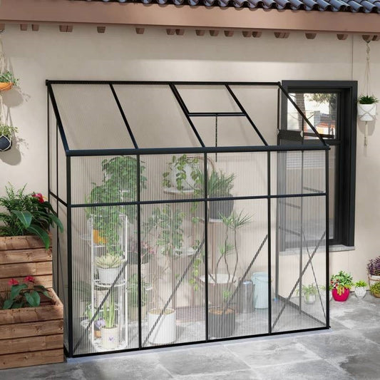 8.3 ft x 4.1 ft Outdoor Polycarbonate Lean-to Greenhouse with Black Metal Frame attached to a house with plants inside.