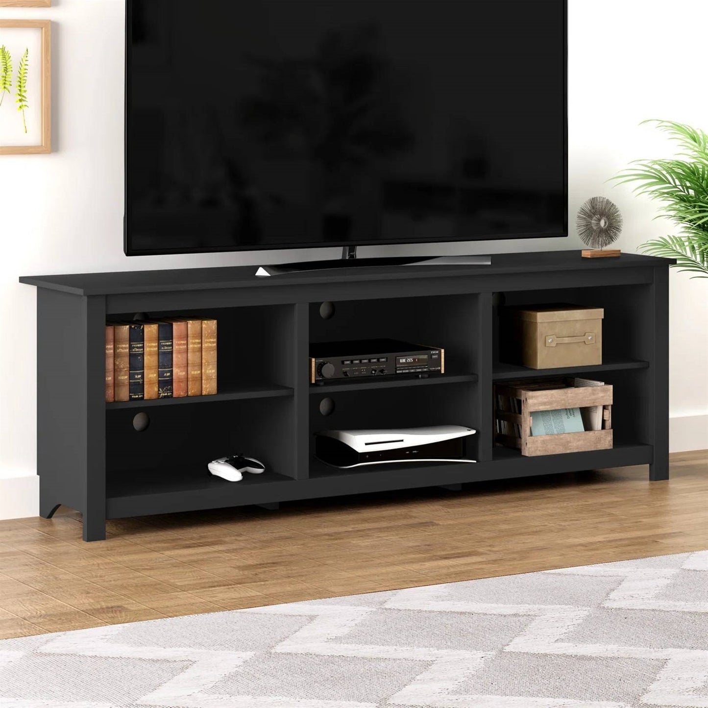 Farmhouse TV Stand in Black Wood Finish - for TVs up to 70-inch with shelves and cabinet in living room setting