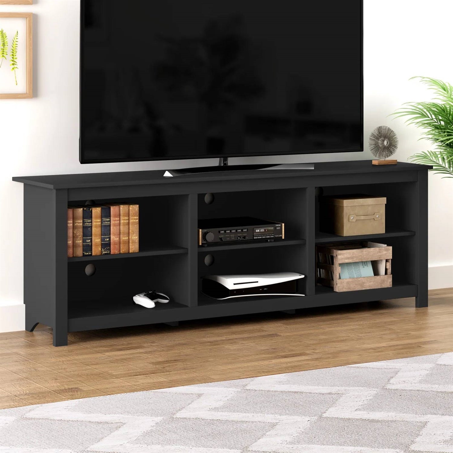 Farmhouse TV Stand in Black Wood Finish - for TVs up to 70-inch with shelves and cabinet in living room setting
