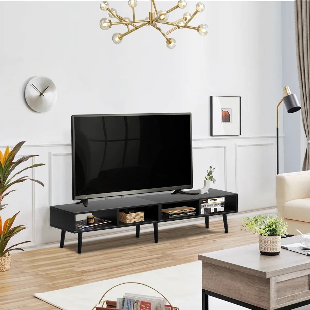 Mid-Century Modern Style TV Stand in Black Wood Finish - for TVs up to 65-inch in a modern living room setting