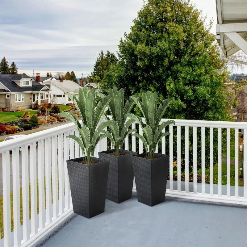 Set of 3 - Black Faux Rattan Plastic Tall Large Flower Pots on a balcony with greenery