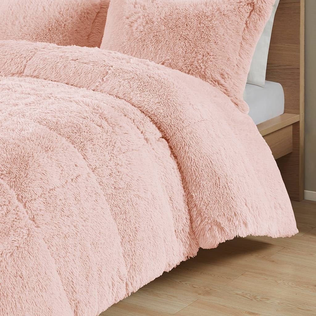 Twin/Twin XL Pink Blush Soft Sherpa Faux Fur 2-Piece Comforter Set on bed with wooden frame.