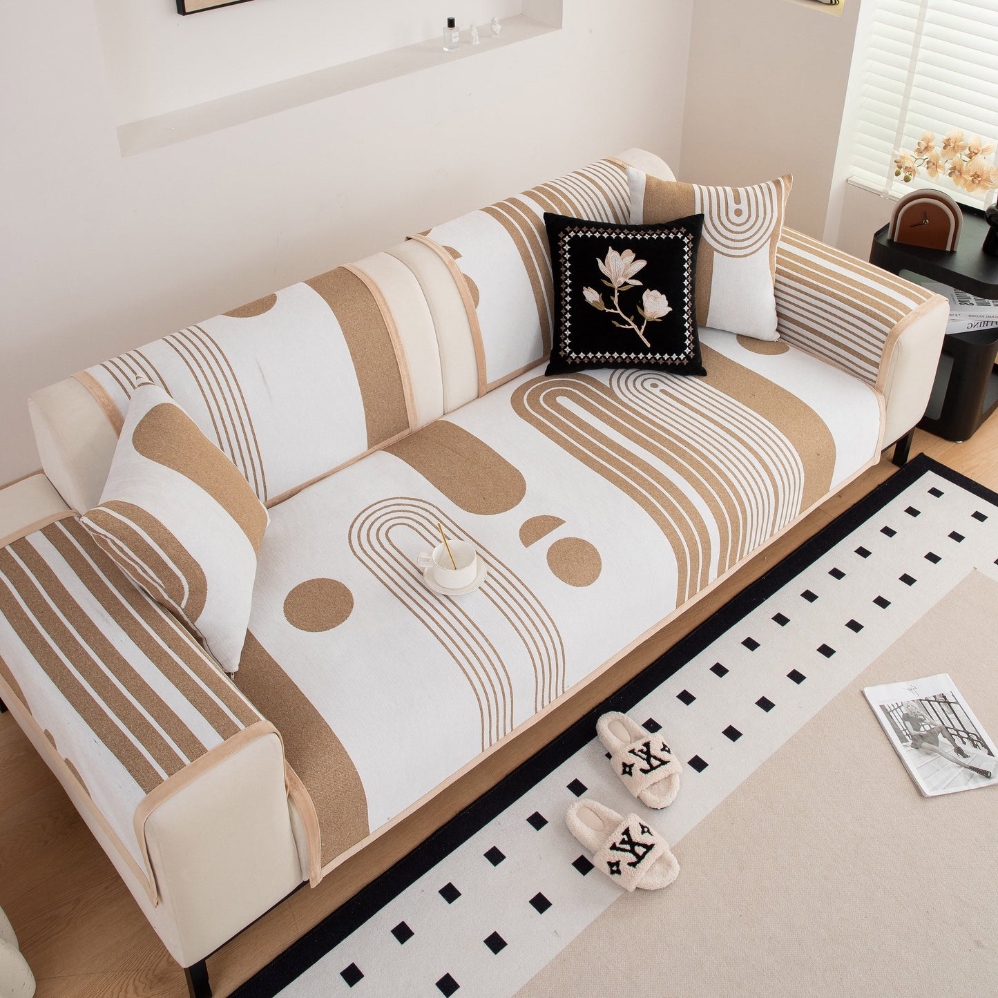 Modern Geometric Sofa Cover - Thick Woven, Pet Friendly, Stylish Couch Protector on a beige sofa in a contemporary living room