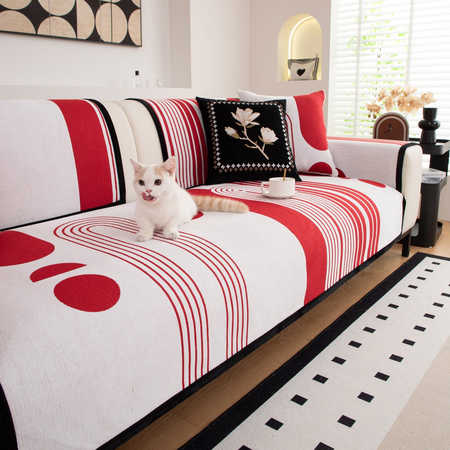 Modern Geometric Sofa Cover - Thick Woven, Pet Friendly, Stylish Couch Protector with bold red and white patterns, featuring a cute pet cat.