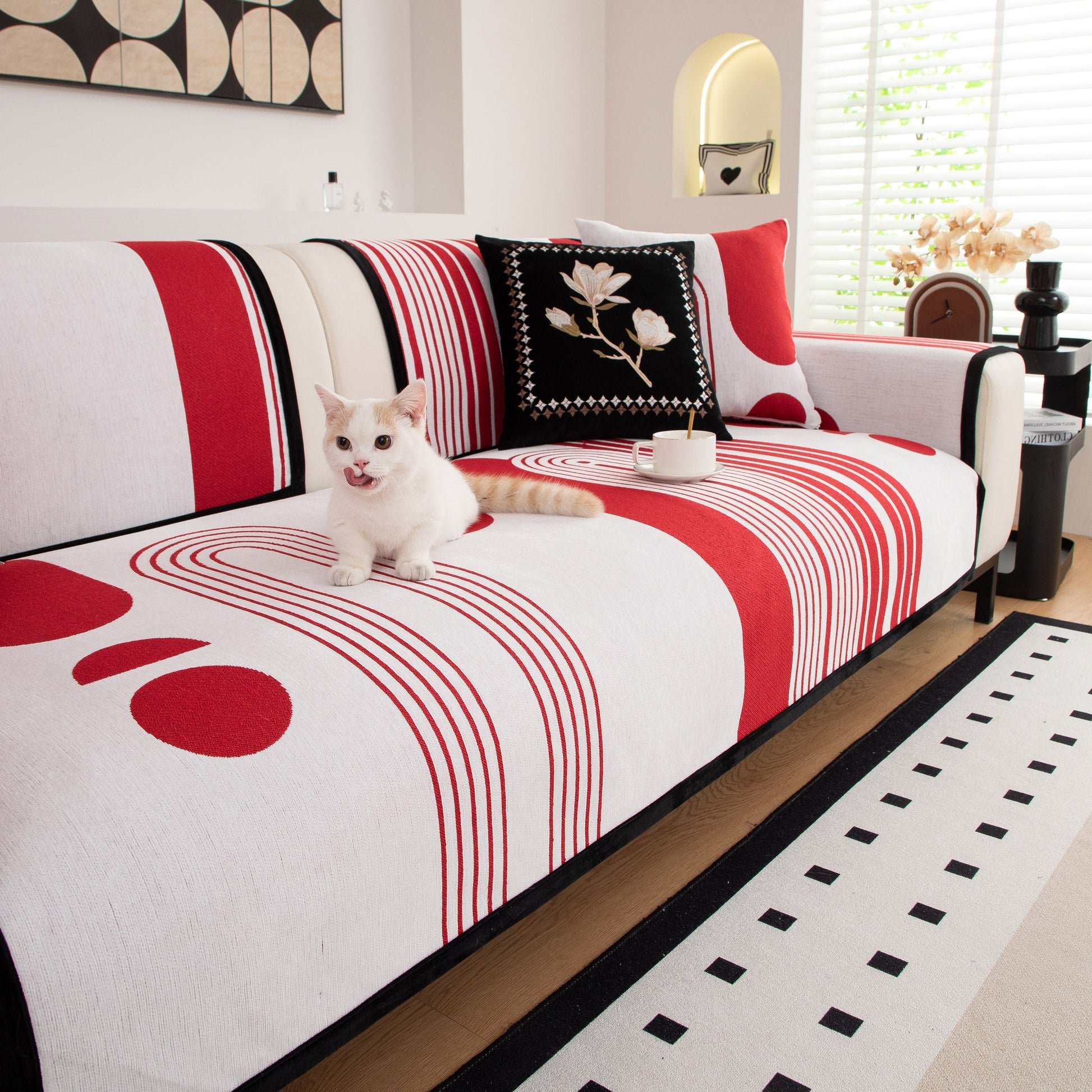 Modern Geometric Sofa Cover - Thick Woven, Pet Friendly, Stylish Couch Protector with bold red and white patterns, featuring a cute pet cat.