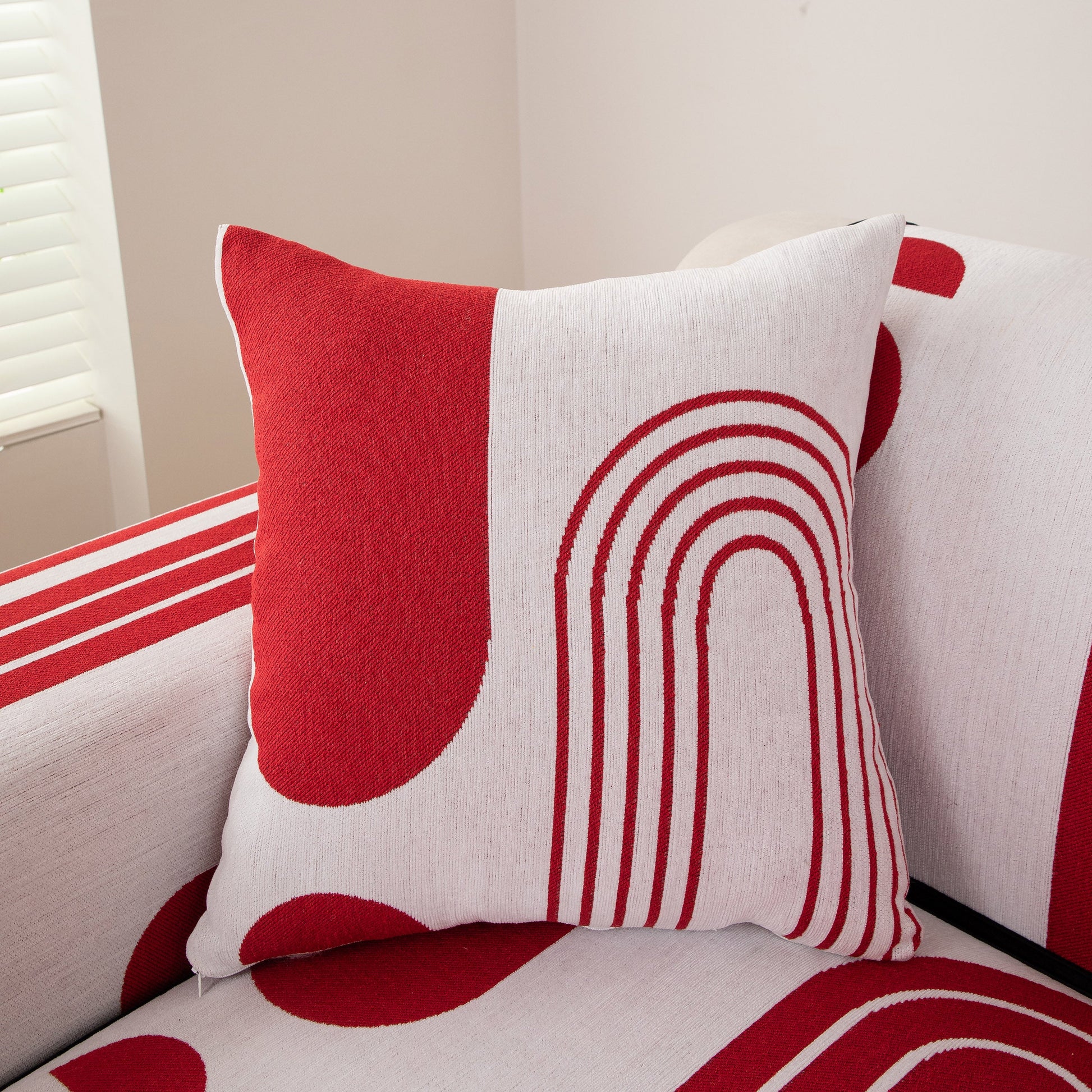 Modern Geometric Sofa Cover - Thick Woven, Pet Friendly, Stylish Couch Protector in red and white with bold curves and circular patterns.