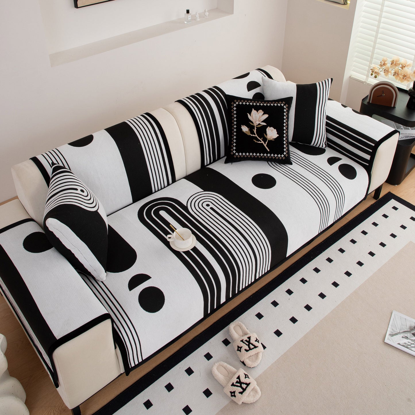 Modern Geometric Sofa Cover - Thick Woven, Pet Friendly, Stylish Couch Protector with bold black and white patterns in living room.