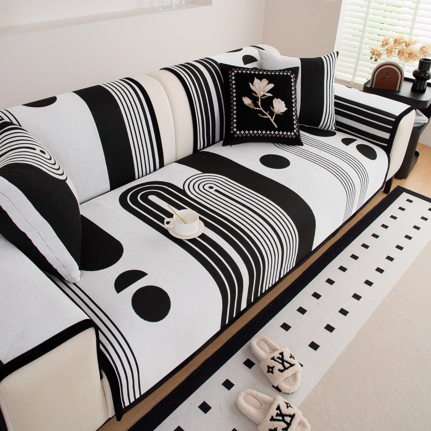 Modern Geometric Sofa Cover - Thick Woven, Pet Friendly, Stylish Couch Protector with bold black and white patterns on a sofa.