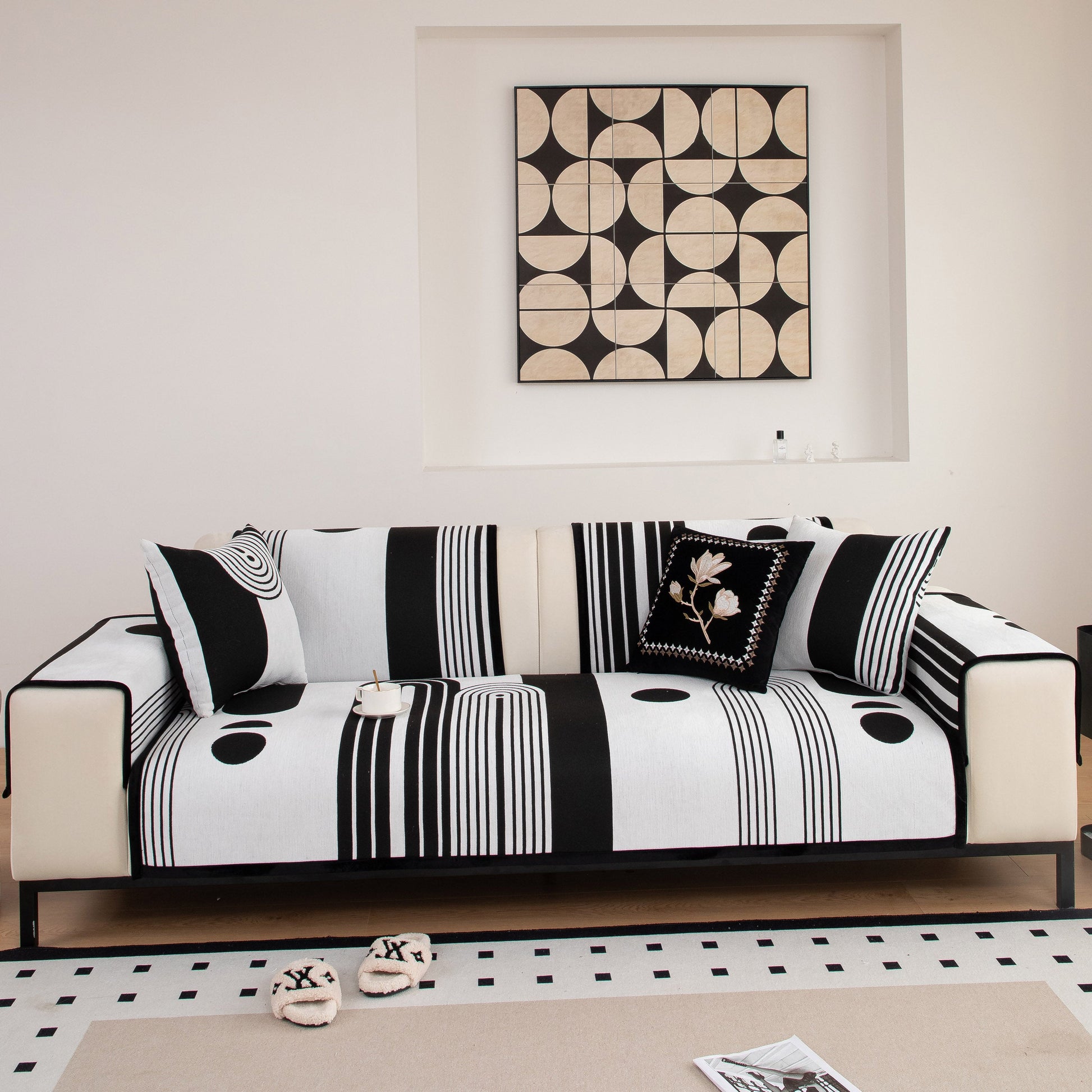 Modern Geometric Sofa Cover - Thick Woven, Pet Friendly, Stylish Couch Protector on black and white striped sofa in modern living room