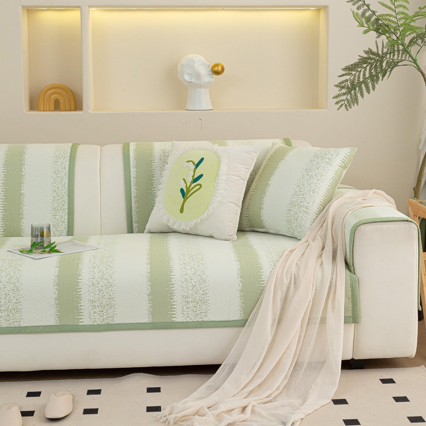 Striped Non-Slip Cooling Couch Cover, Summer Couch Pads for Seat Back Armrest in living room setting with decorative pillow.