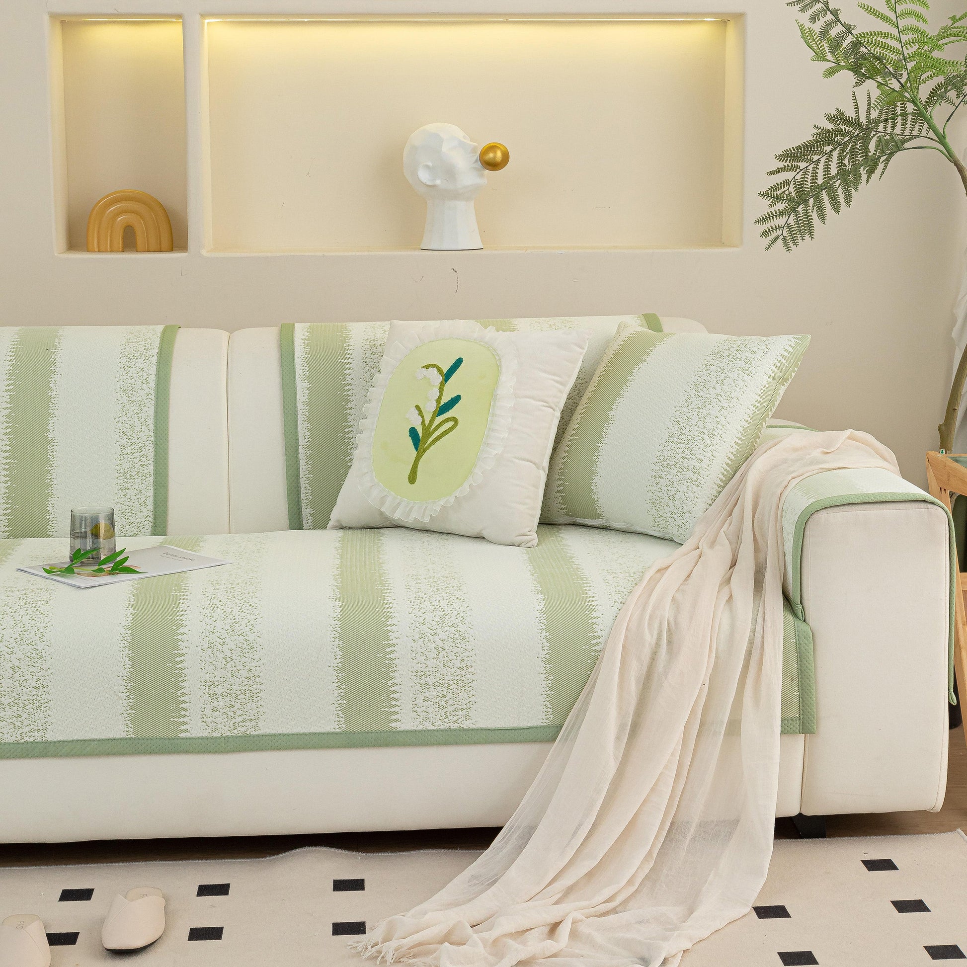 Striped Non-Slip Cooling Couch Cover, Summer Couch Pads for Seat Back Armrest in living room setting with decorative pillow.