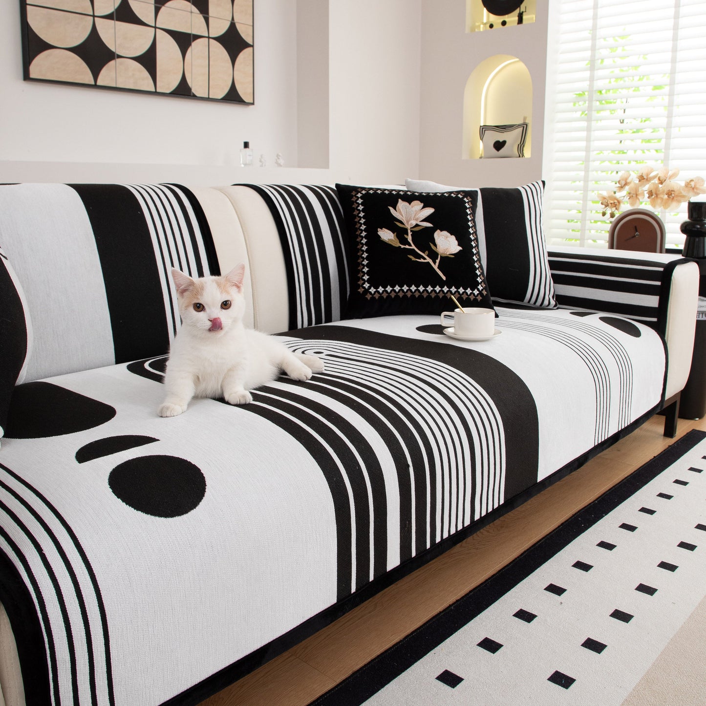 Modern Geometric Sofa Cover - Thick Woven, Pet Friendly, Stylish Couch Protector in black and white with a cat and coffee mug