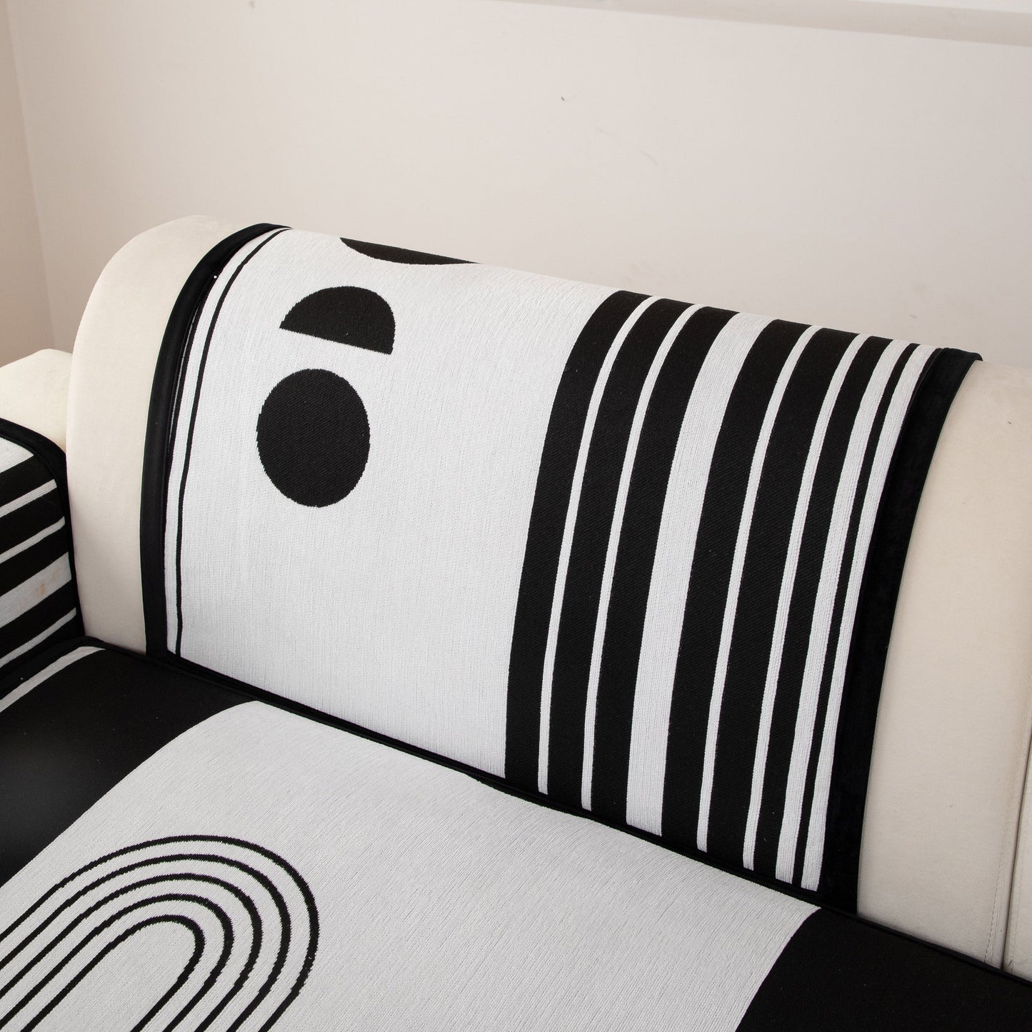 Modern Geometric Sofa Cover - Thick Woven, Pet Friendly, Stylish Couch Protector with bold black and white patterns on a sofa.