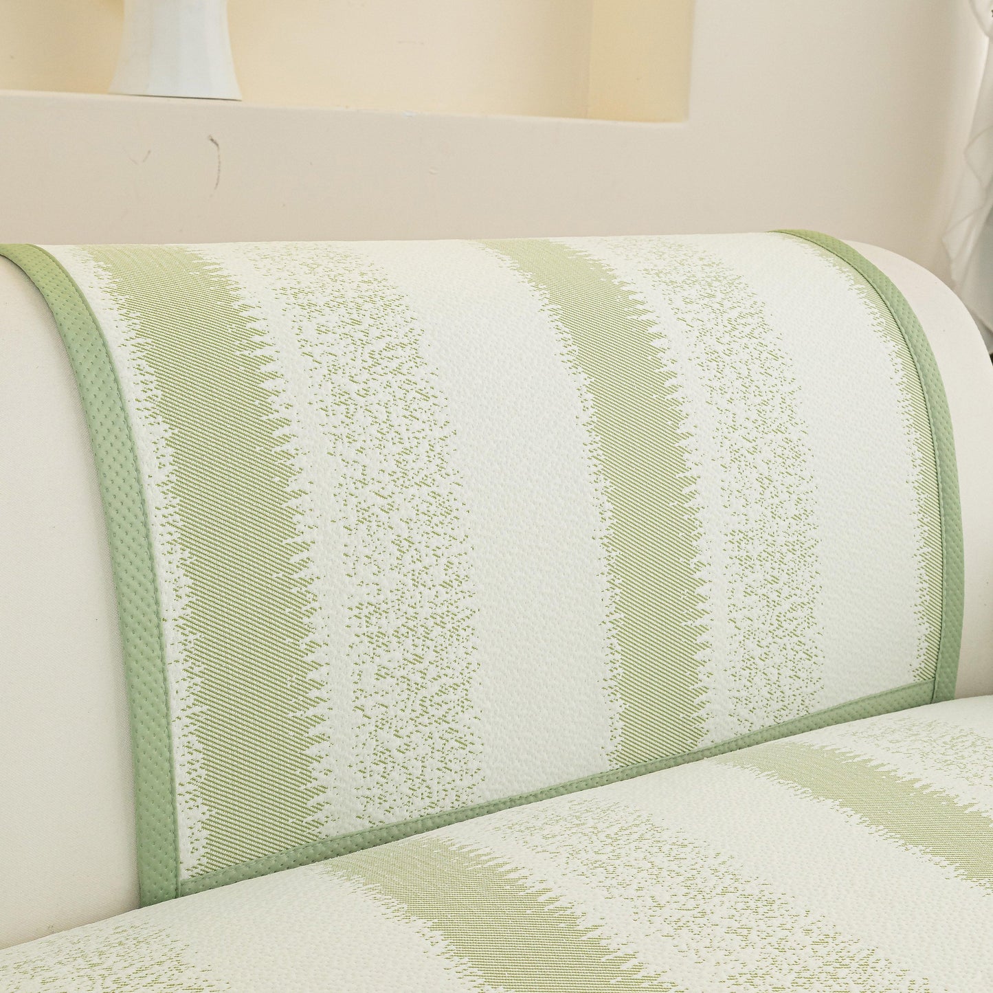 Striped Non-Slip Cooling Couch Cover, Summer Couch Pads for Seat Back Armrest in green and white on a sofa.