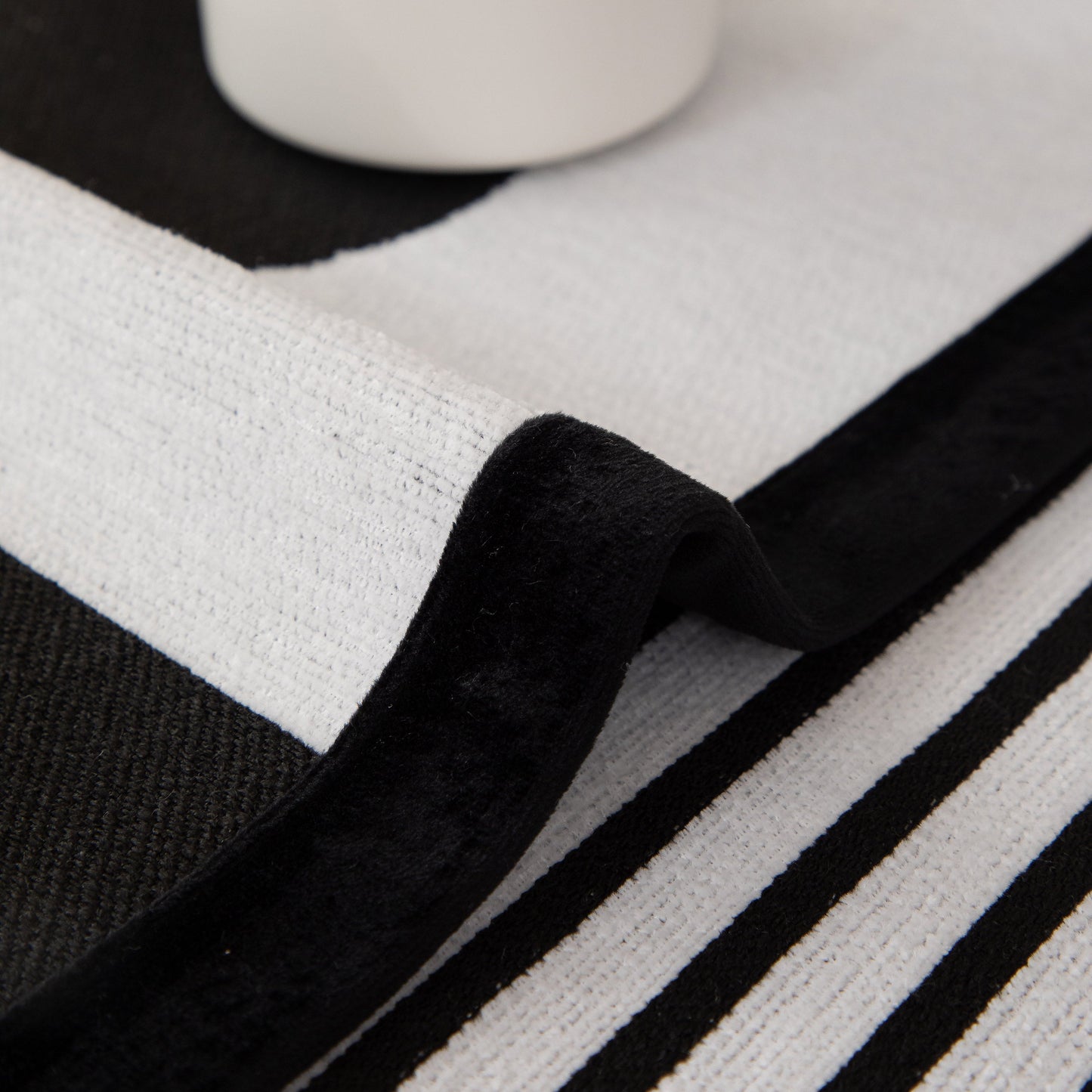 Modern Geometric Sofa Cover - Thick Woven, Pet Friendly, Stylish Couch Protector with black and white stripes.