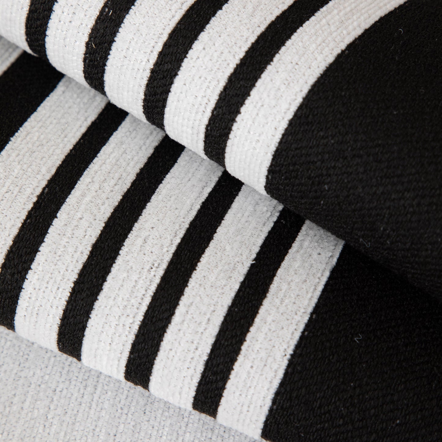 Close-up of black and white striped Modern Geometric Sofa Cover - Thick Woven, Pet Friendly, Stylish Couch Protector.