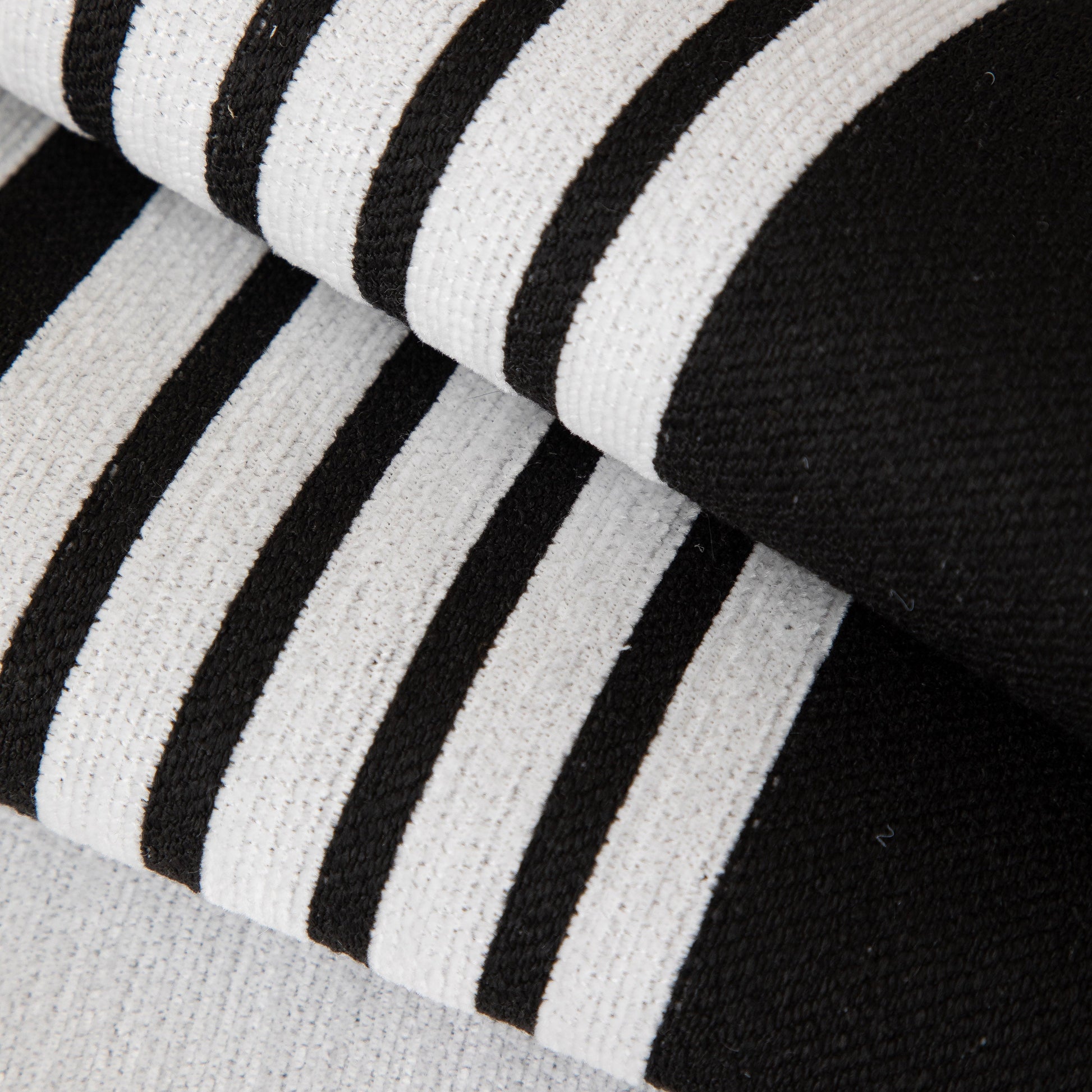 Close-up of black and white striped Modern Geometric Sofa Cover - Thick Woven, Pet Friendly, Stylish Couch Protector.