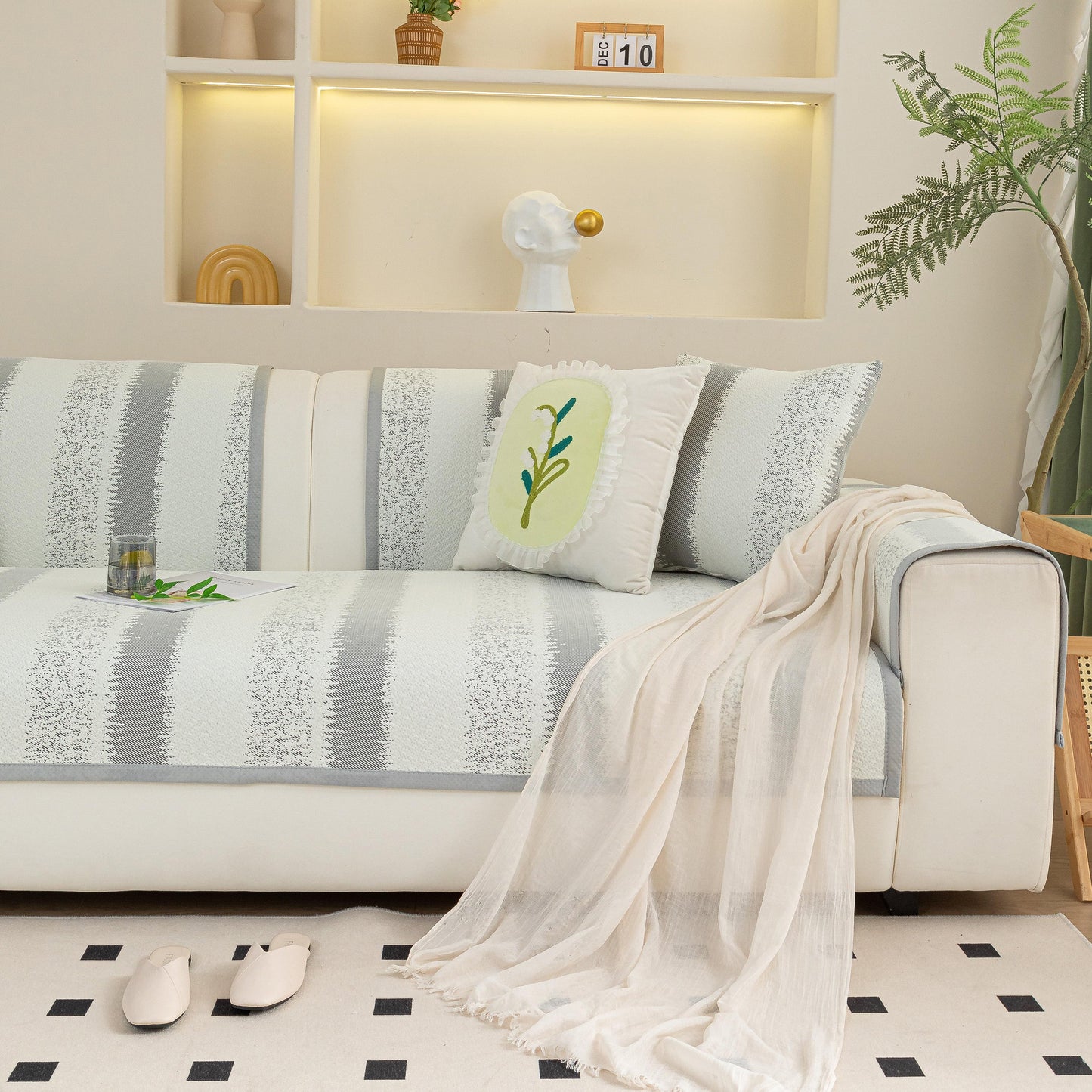 Striped Non-Slip Cooling Couch Cover, Summer Couch Pads for Seat Back Armrest on modern sofa with decorative elements.