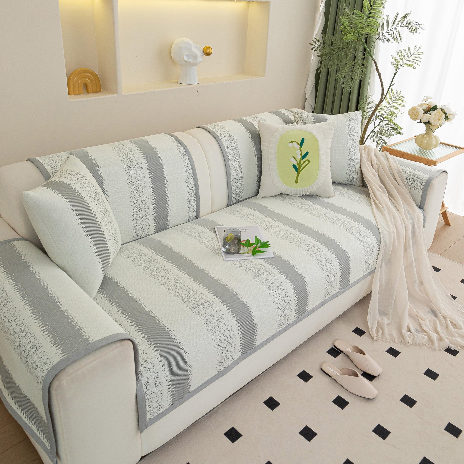 Striped Non-Slip Cooling Couch Cover, Summer Couch Pads for Seat Back Armrest on a white sofa in a bright living room.