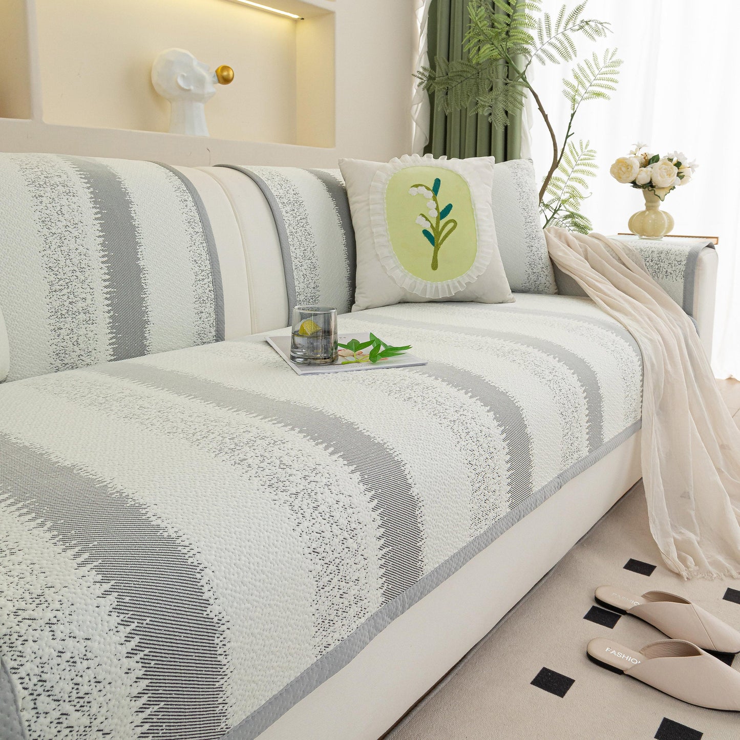 Striped Non-Slip Cooling Couch Cover, Summer Couch Pads for Seat Back Armrest on a stylish sofa with decorative pillows and a cozy atmosphere.