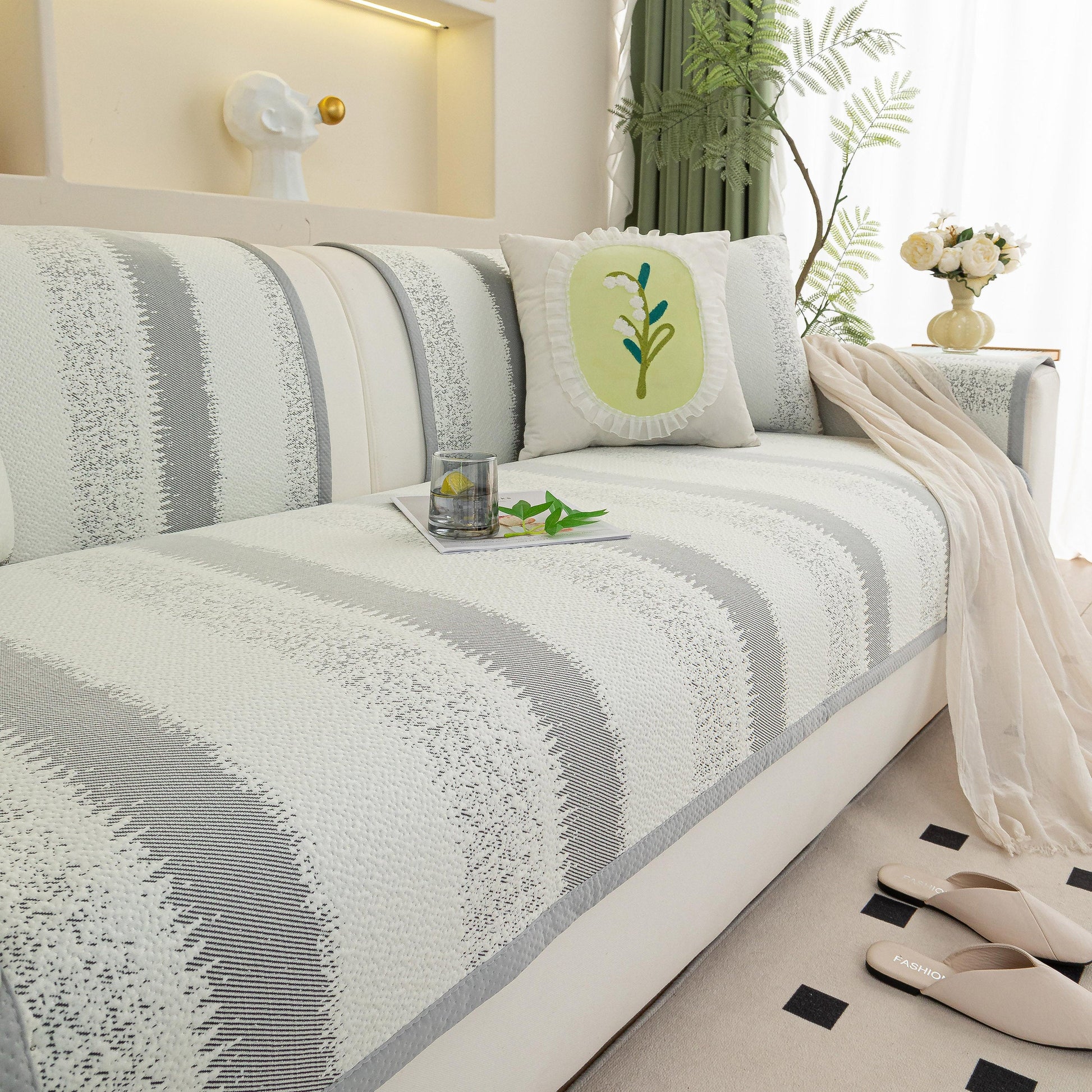 Striped Non-Slip Cooling Couch Cover, Summer Couch Pads for Seat Back Armrest on a stylish sofa with decorative pillows and a cozy atmosphere.