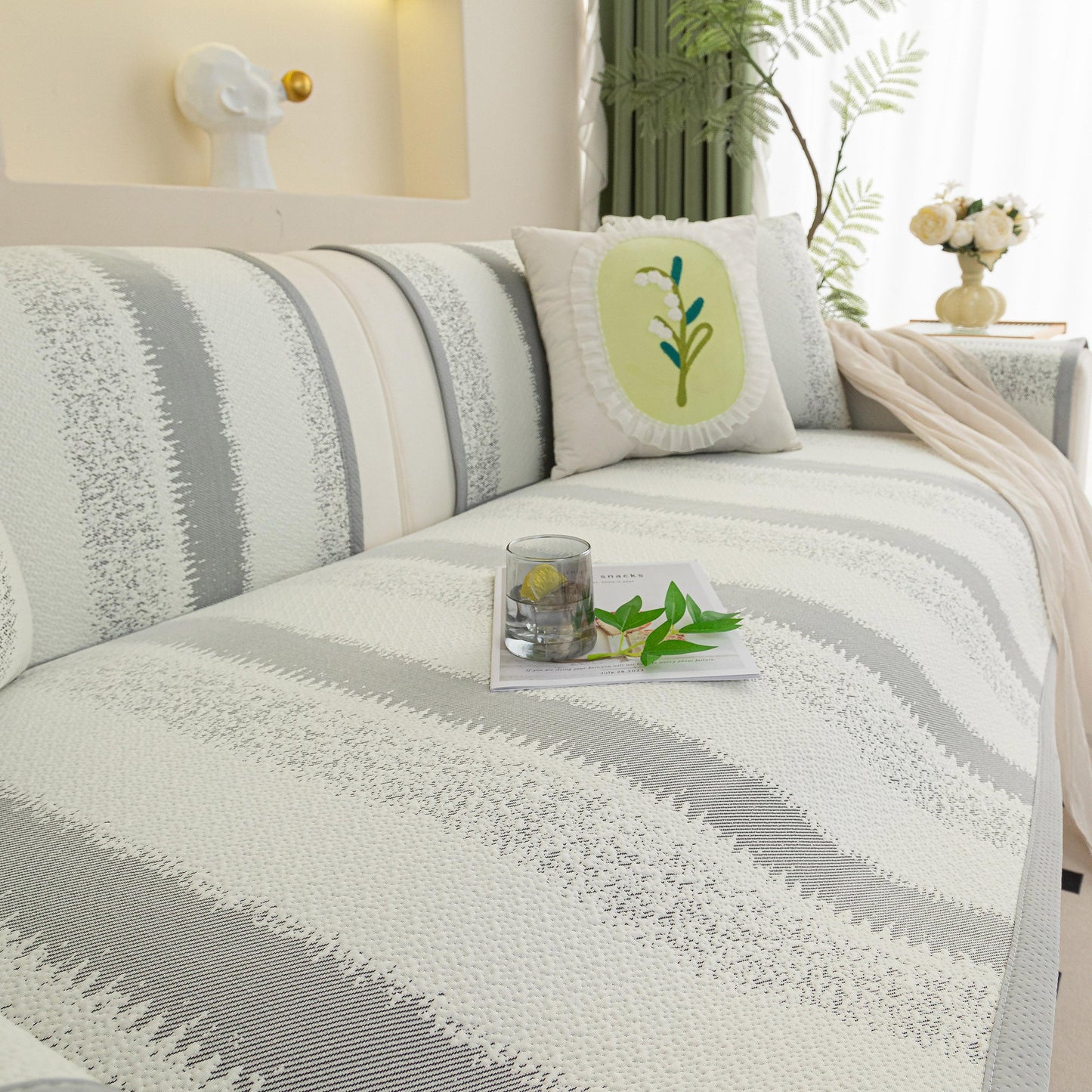 Striped Non-Slip Cooling Couch Cover, Summer Couch Pads for Seat Back Armrest on a stylish sofa enhancing comfort and style.