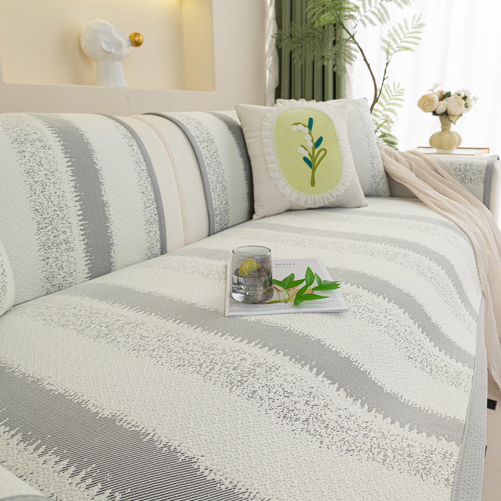 Striped Non-Slip Cooling Couch Cover, Summer Couch Pads for Seat Back Armrest on a stylish sofa enhancing comfort and style.