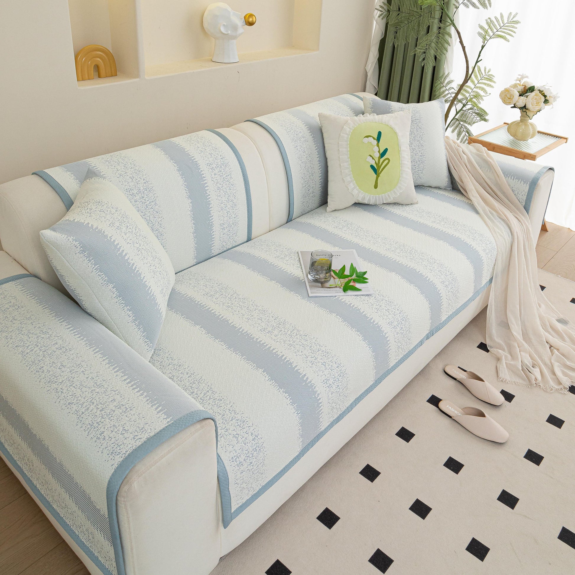 Striped Non-Slip Cooling Couch Cover, Summer Couch Pads for Seat Back Armrest on stylish sofa with decorative pillows.
