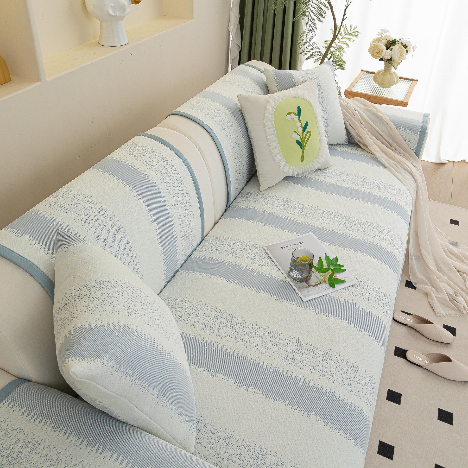 Striped Non-Slip Cooling Couch Cover, Summer Couch Pads for Seat Back Armrest in stylish living room setting with decorative pillows.