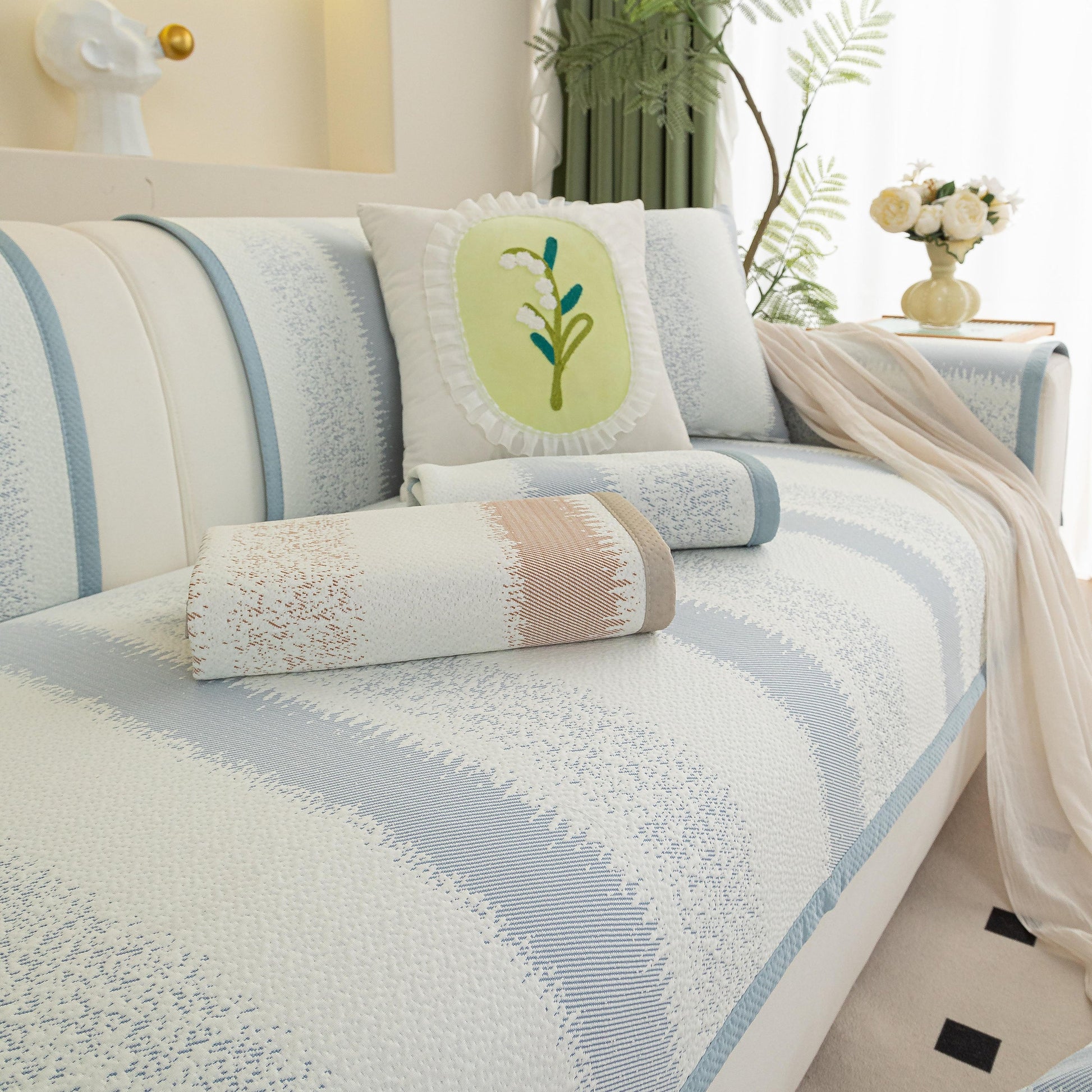 Striped Non-Slip Cooling Couch Cover, Summer Couch Pads for Seat Back Armrest on a sofa enhancing comfort and style.