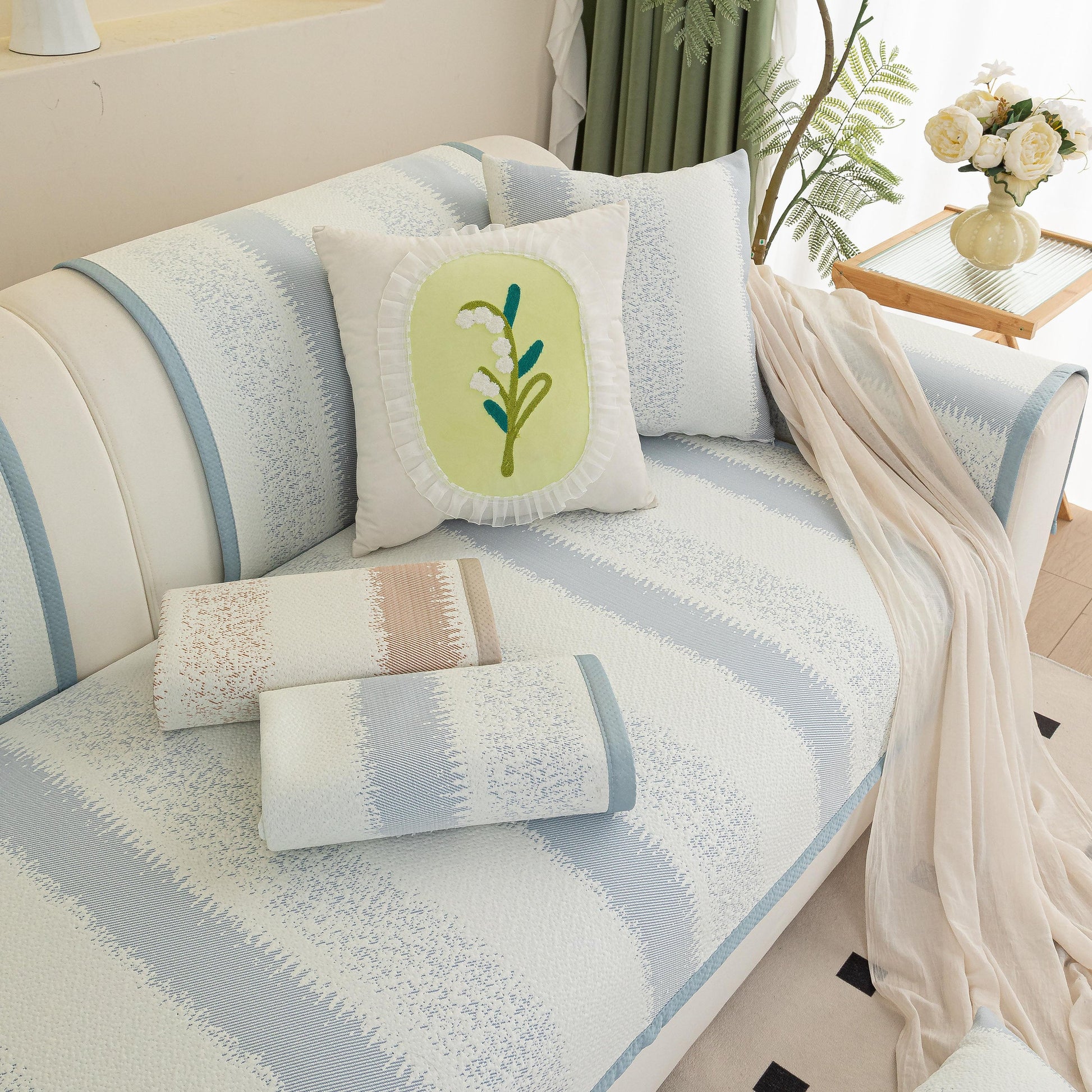Striped Non-Slip Cooling Couch Cover on sofa with decorative pillows and draped blanket, Summer Couch Pads for Seat Back Armrest.