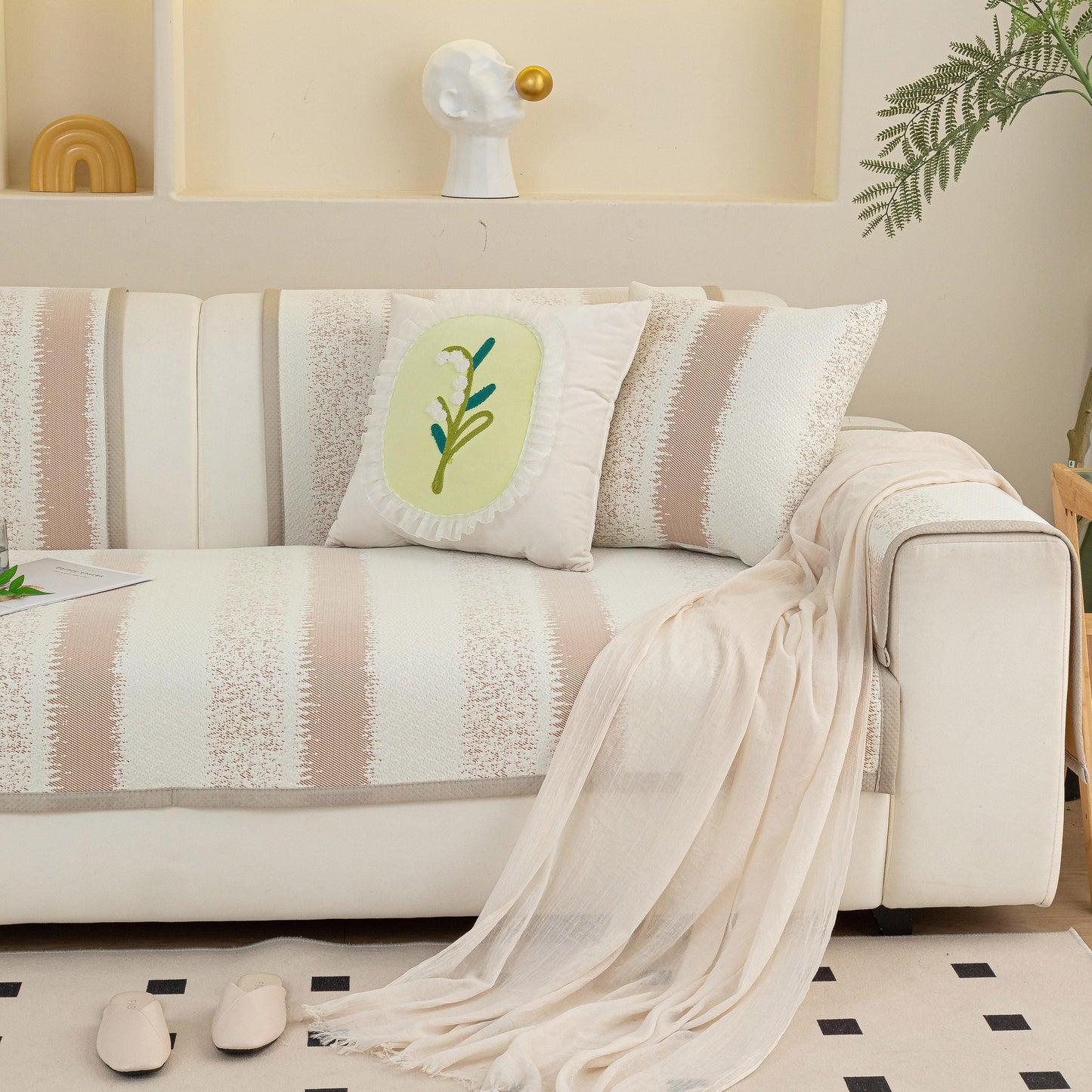 Striped Non-Slip Cooling Couch Cover, Summer Couch Pads for Seat Back Armrest on a beige sofa with decorative pillows and a throw.