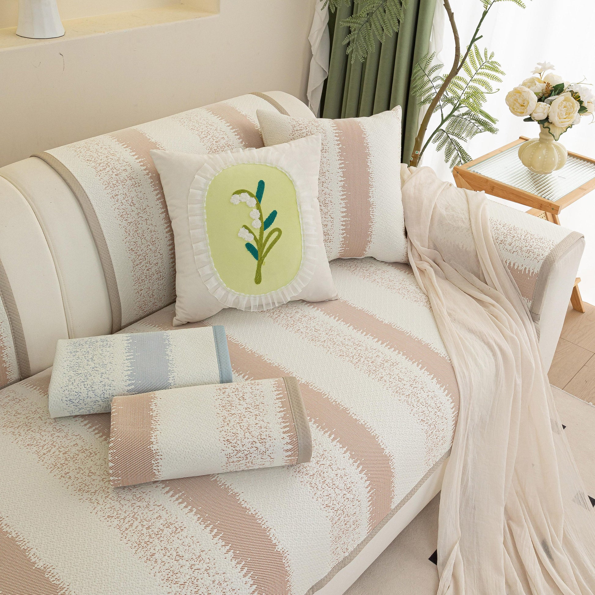 Striped Non-Slip Cooling Couch Cover, Summer Couch Pads for Seat Back Armrest with floral cushion on elegant sofa.
