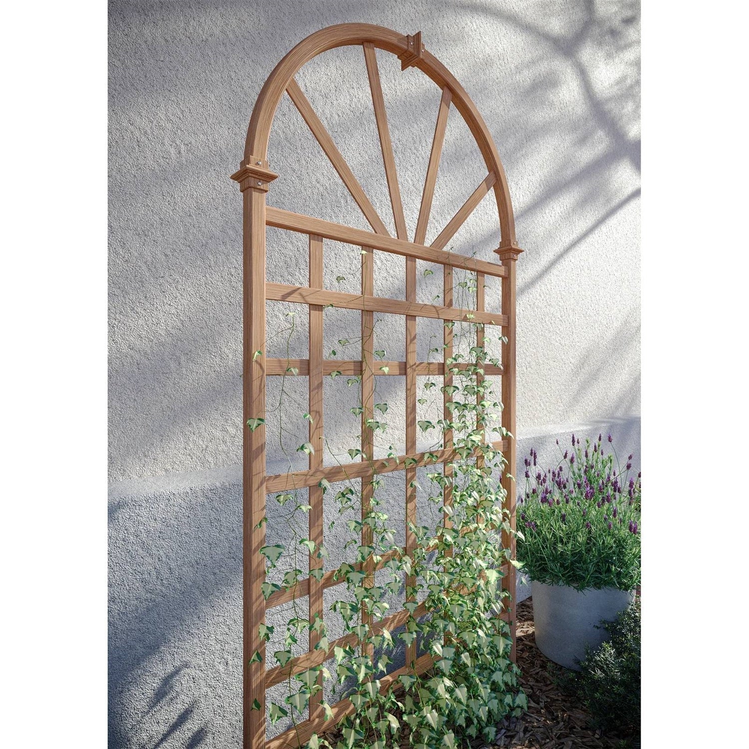 77-inch Outdoor Light Brown Vinyl Lattice Garden Trellis with Arched Top supporting climbing plants outdoors