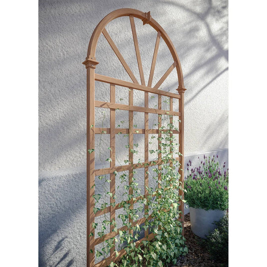 77-inch Outdoor Light Brown Vinyl Lattice Garden Trellis with Arched Top supporting climbing plants outdoors