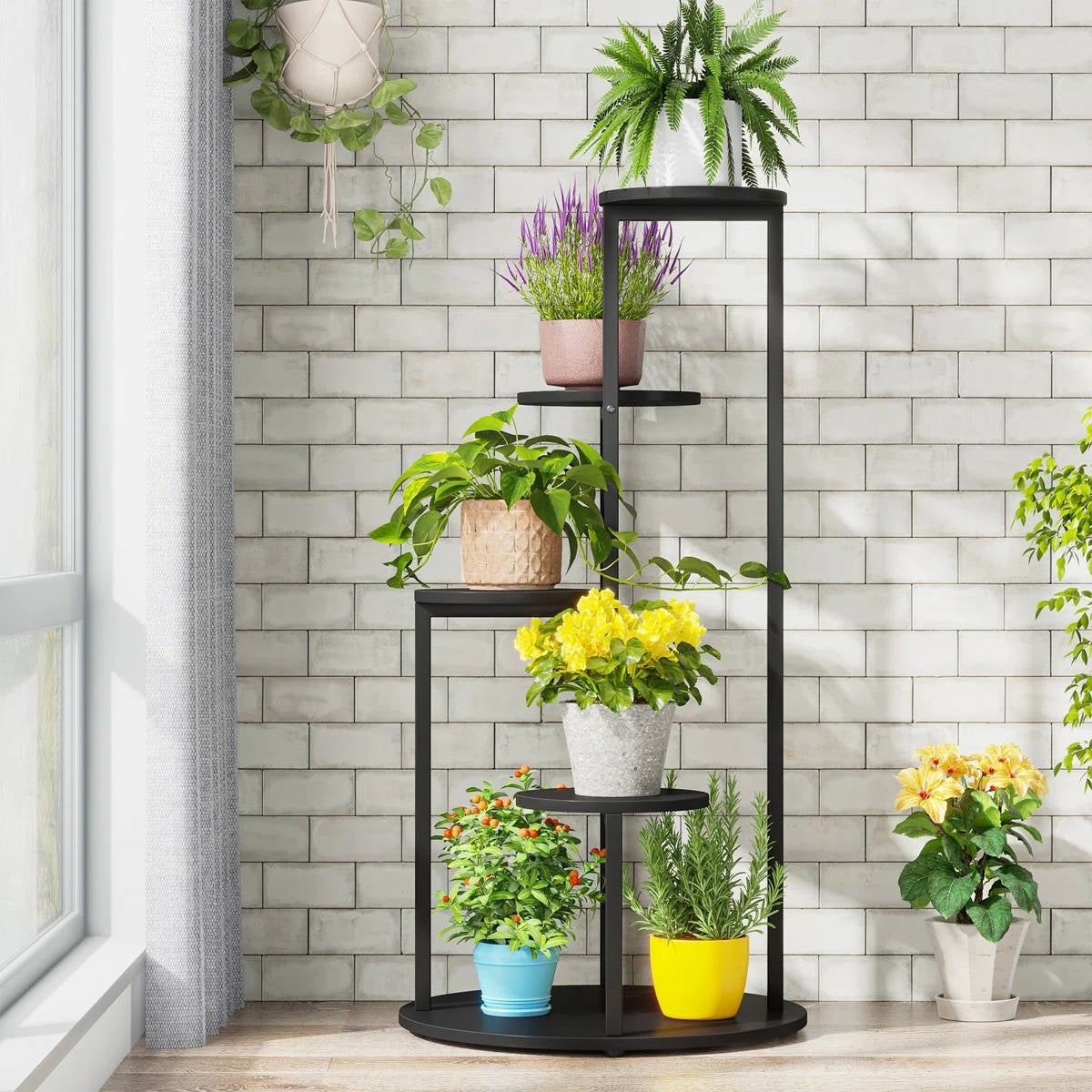 5-Tier Indoor Plant Stand with Black Metal Frame and Brown Wood Finish Shelves displaying potted plants by window.