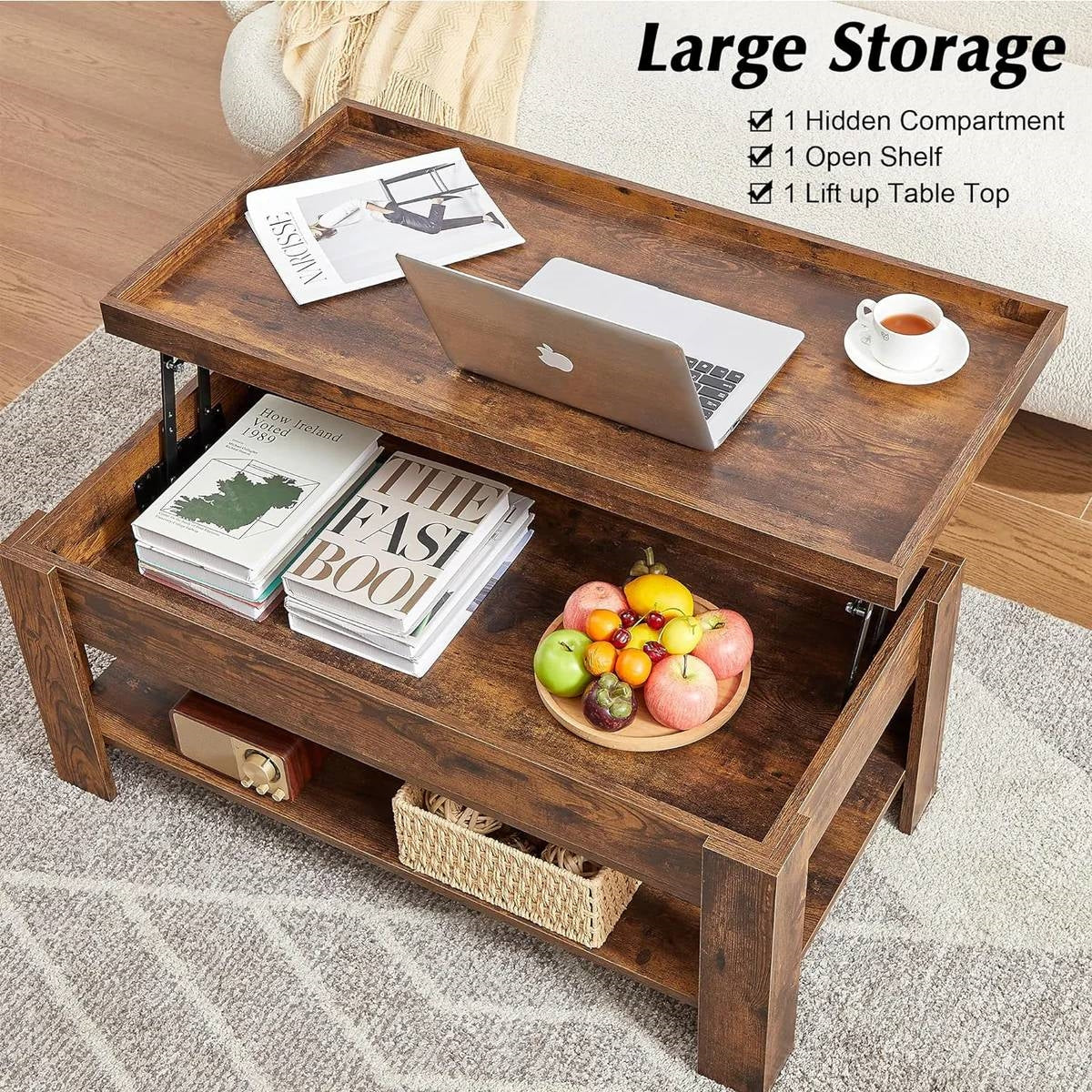 Modern Lift Top Coffee Table with Storage Shelf in Brown Wood Finish used as workspace with laptop, books, and fruit bowl.