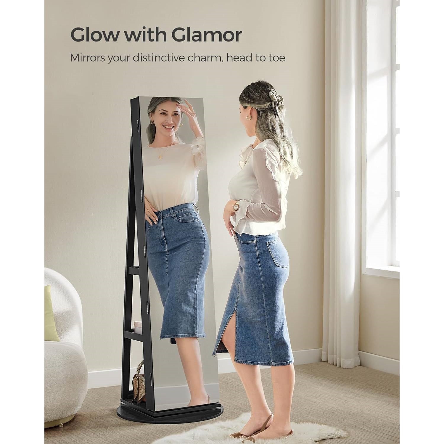 Woman using Black Wood Jewelry Cabinet Armoire Organizer Freestanding Rotating Mirror for full-length view in living room