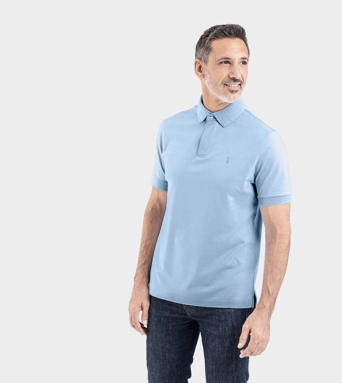 Man wearing a blue Short Sleeve Perfect Polo with StaySharp™ Collar and tailored comfort.