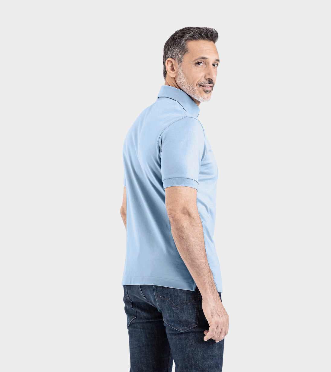 Man wearing light blue Short Sleeve Perfect Polo, showcasing modern fit and StaySharp™ Collar. Great for style and comfort.