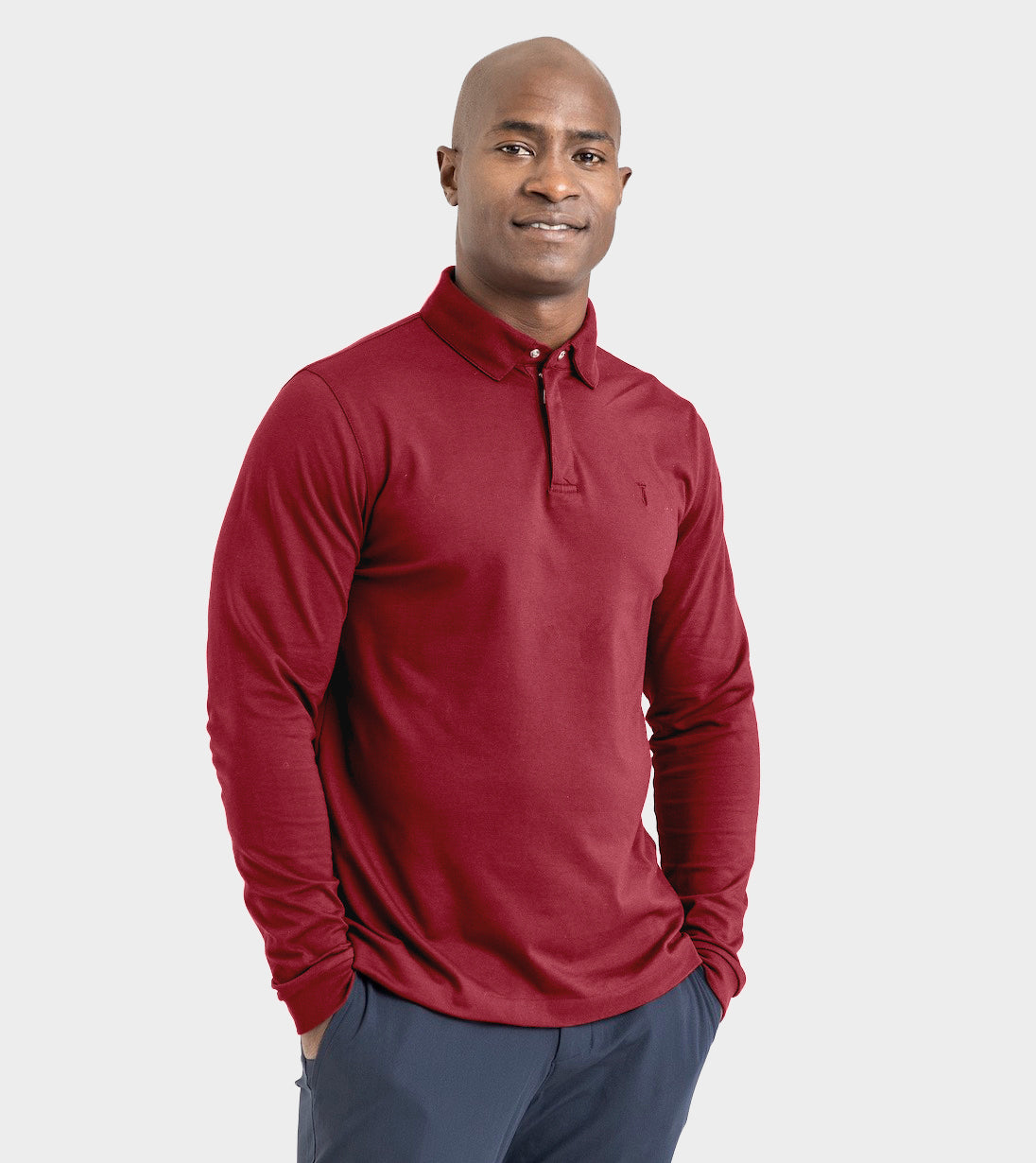 Man wearing a burgundy Long Sleeve Perfect Polo with StaySharp™ Collar and tailored fit for style and comfort.