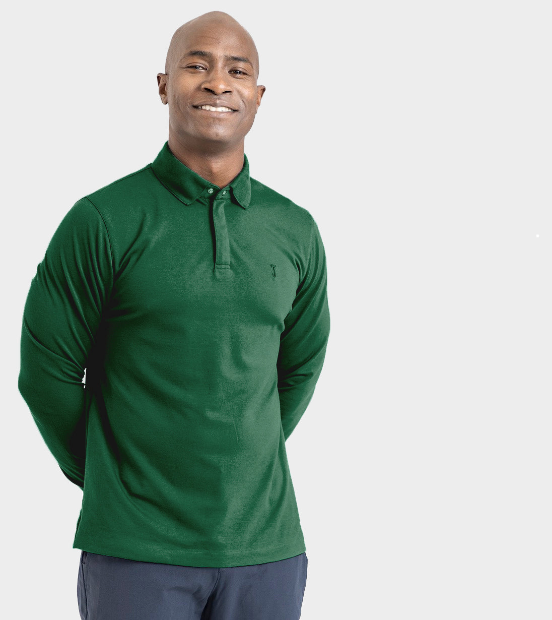 Man wearing Long Sleeve Perfect Polo with StaySharp™ Collar in green, highlighting tailored fit and wrinkle-free fabric.