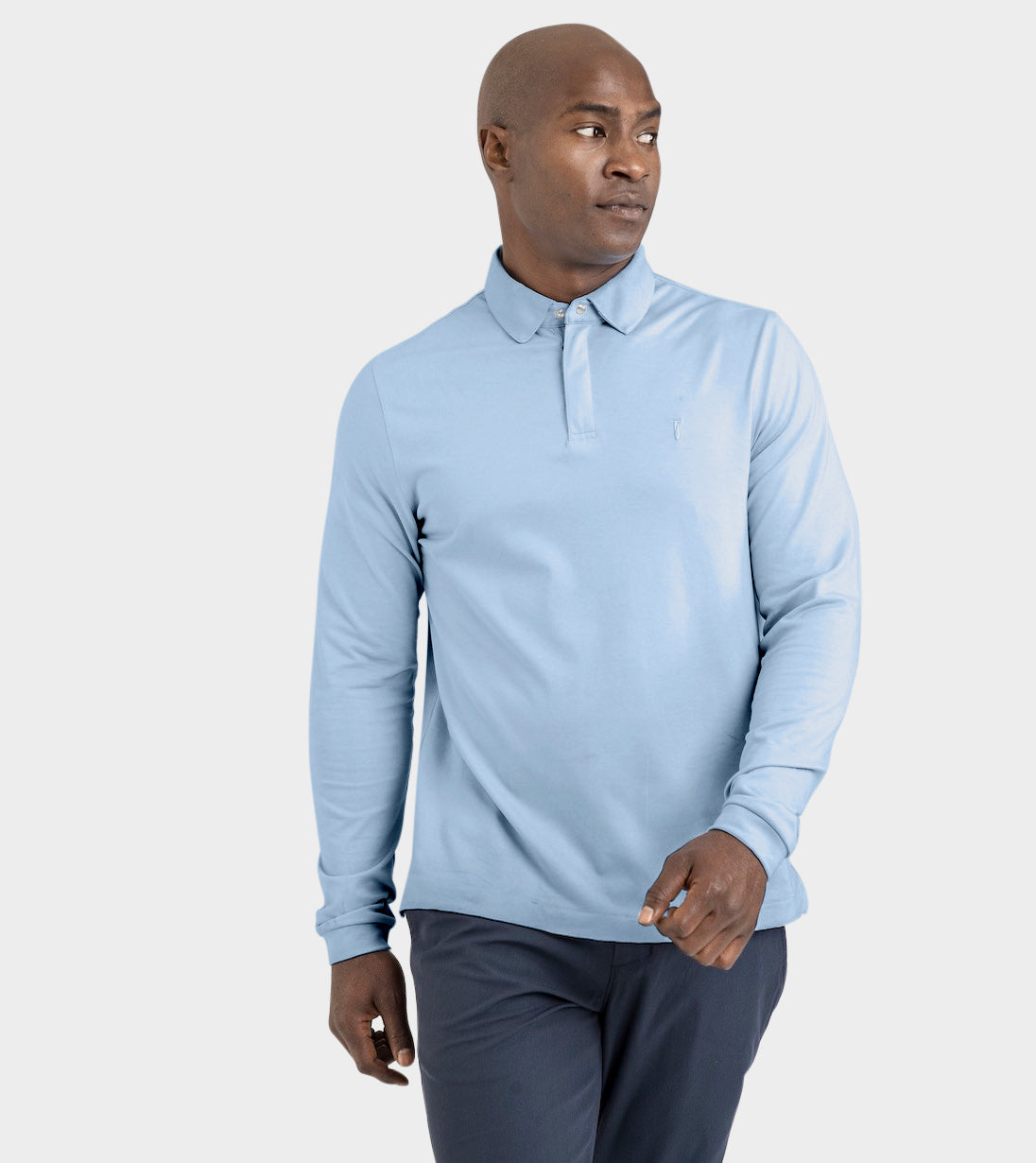 Man wearing Baobab Long Sleeve Perfect Polo in blue, showcasing StaySharp™ Collar and modern fit for refined style and comfort.